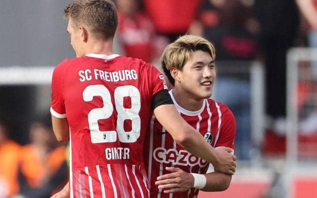 「なんだか可愛い」「カッコ良すぎてやばい」堂安律がドイツ代表DFと肩組み2ショットでキャンプ終了を報告、その笑顔が話題「仲良し感満載」